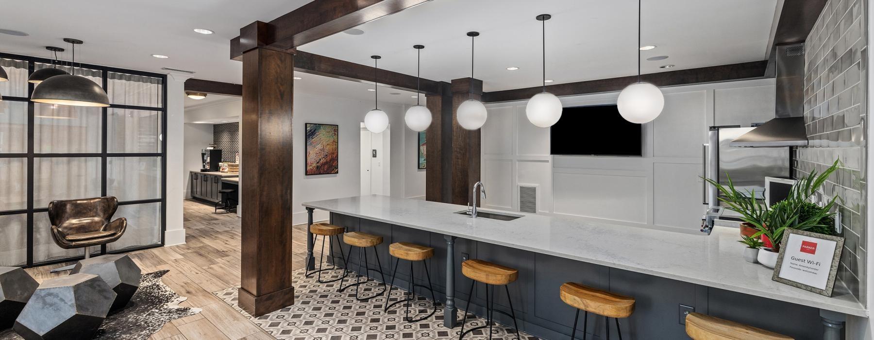 a kitchen with a bar and stools