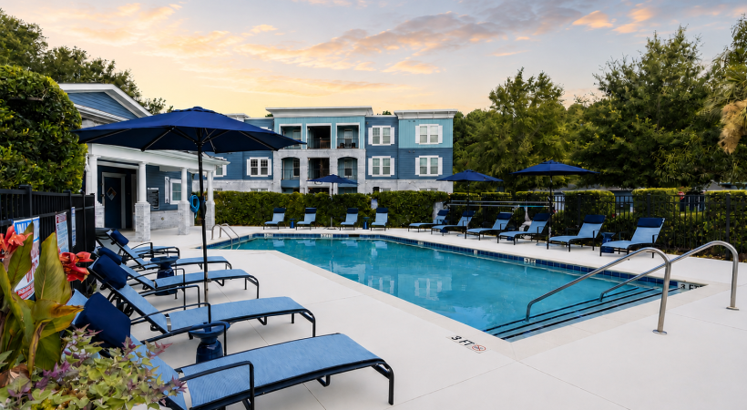  a pool with chairs around it