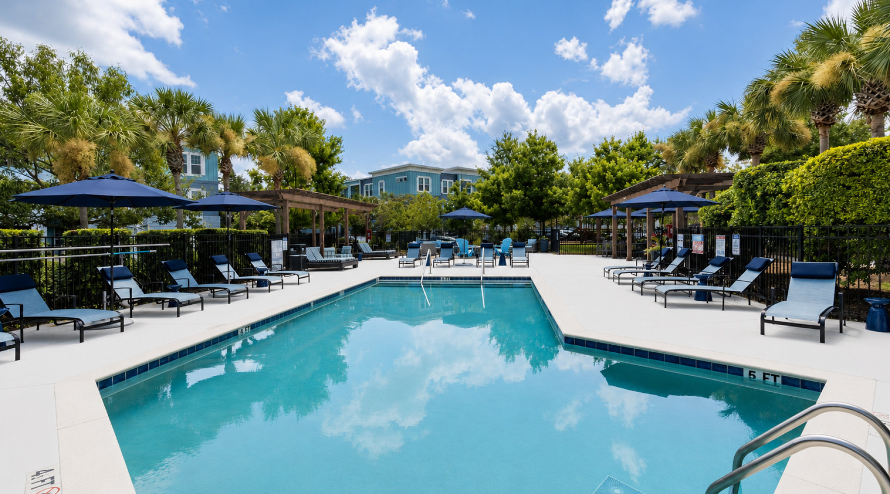 Resort-style swimming pool with lounge seating